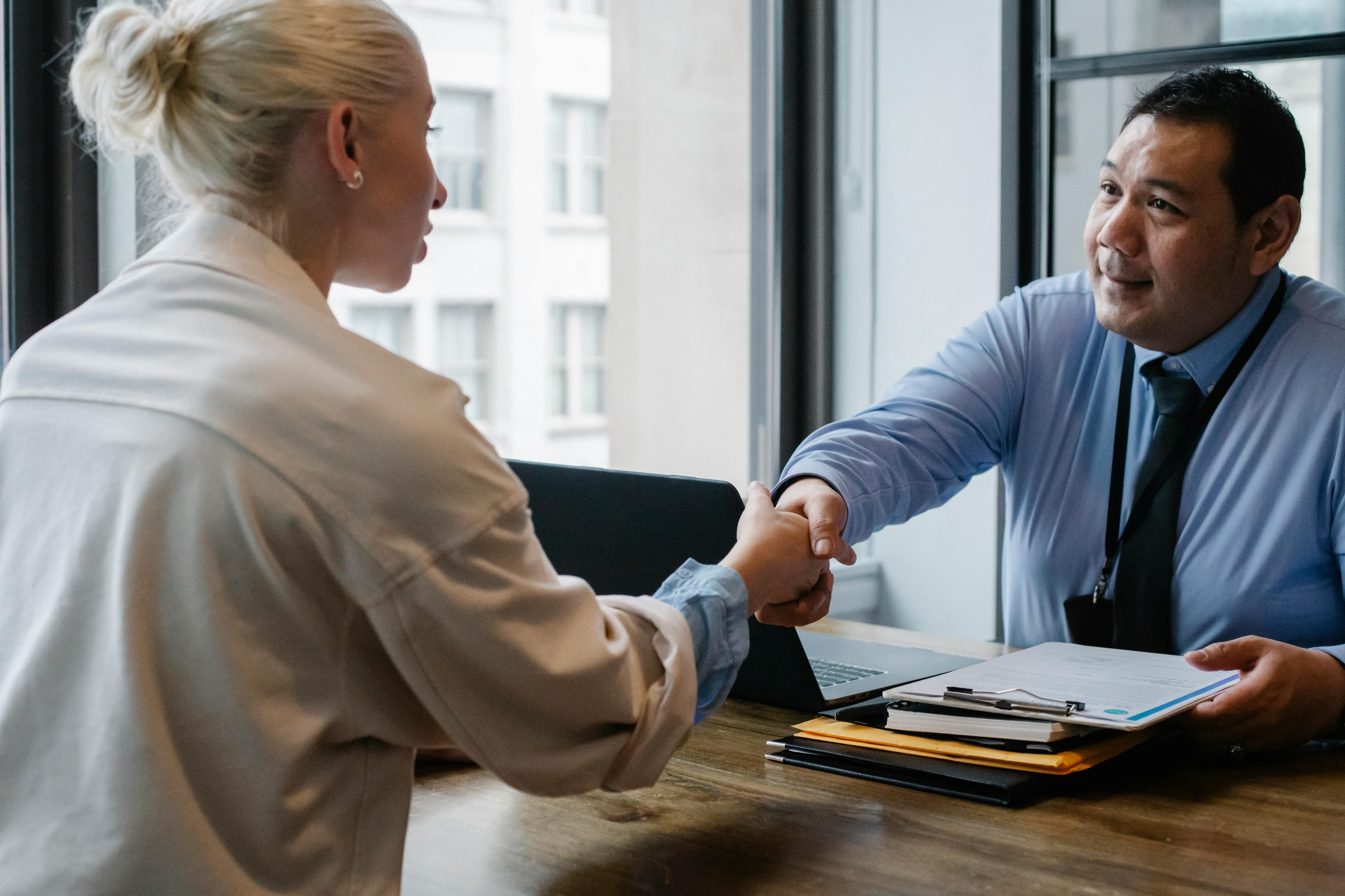 Interview man and woman shaking hands
